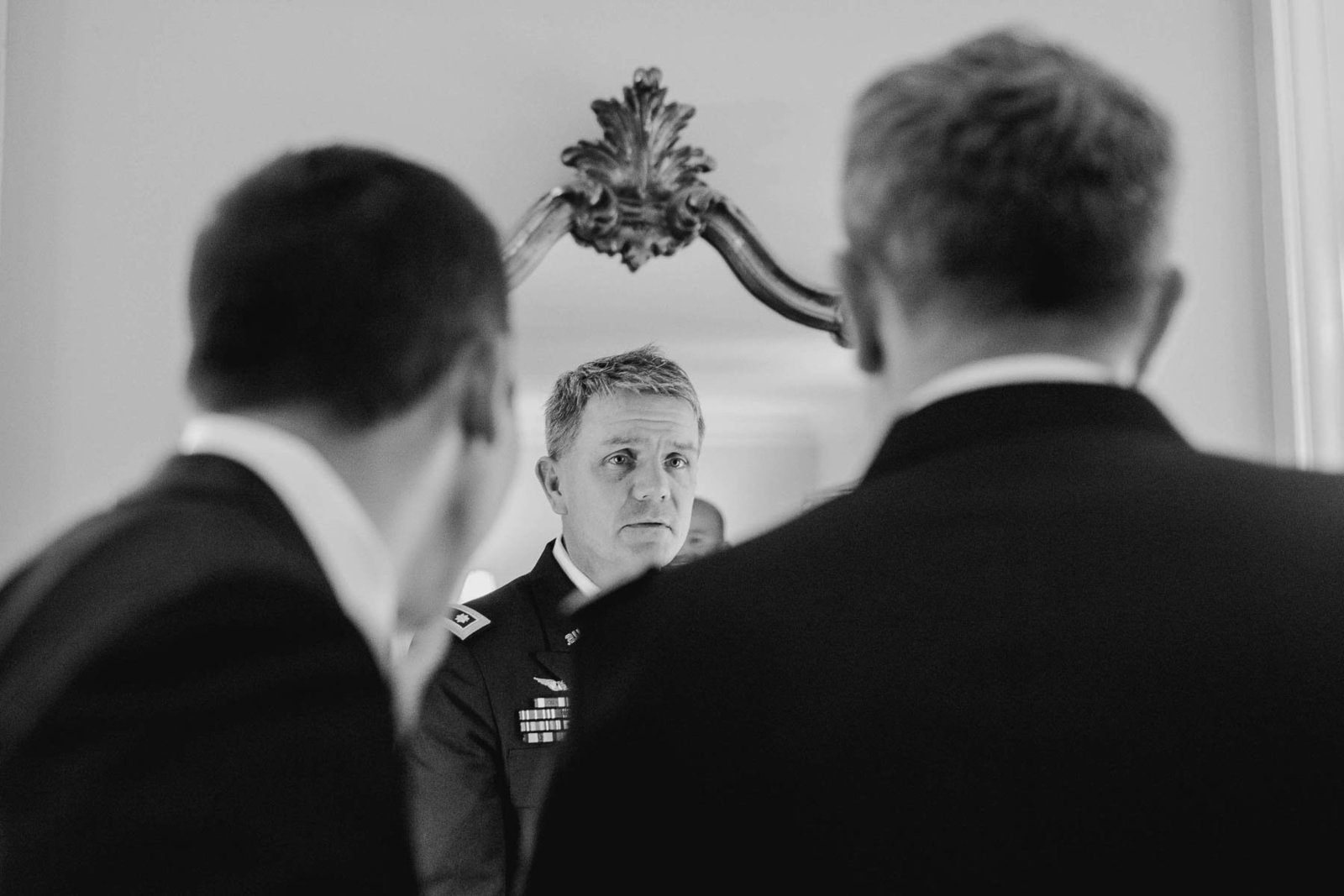 Groom gets into uniform, Stone Manor Country Club, Middletown, Maryland. Kate Timbers Photography.