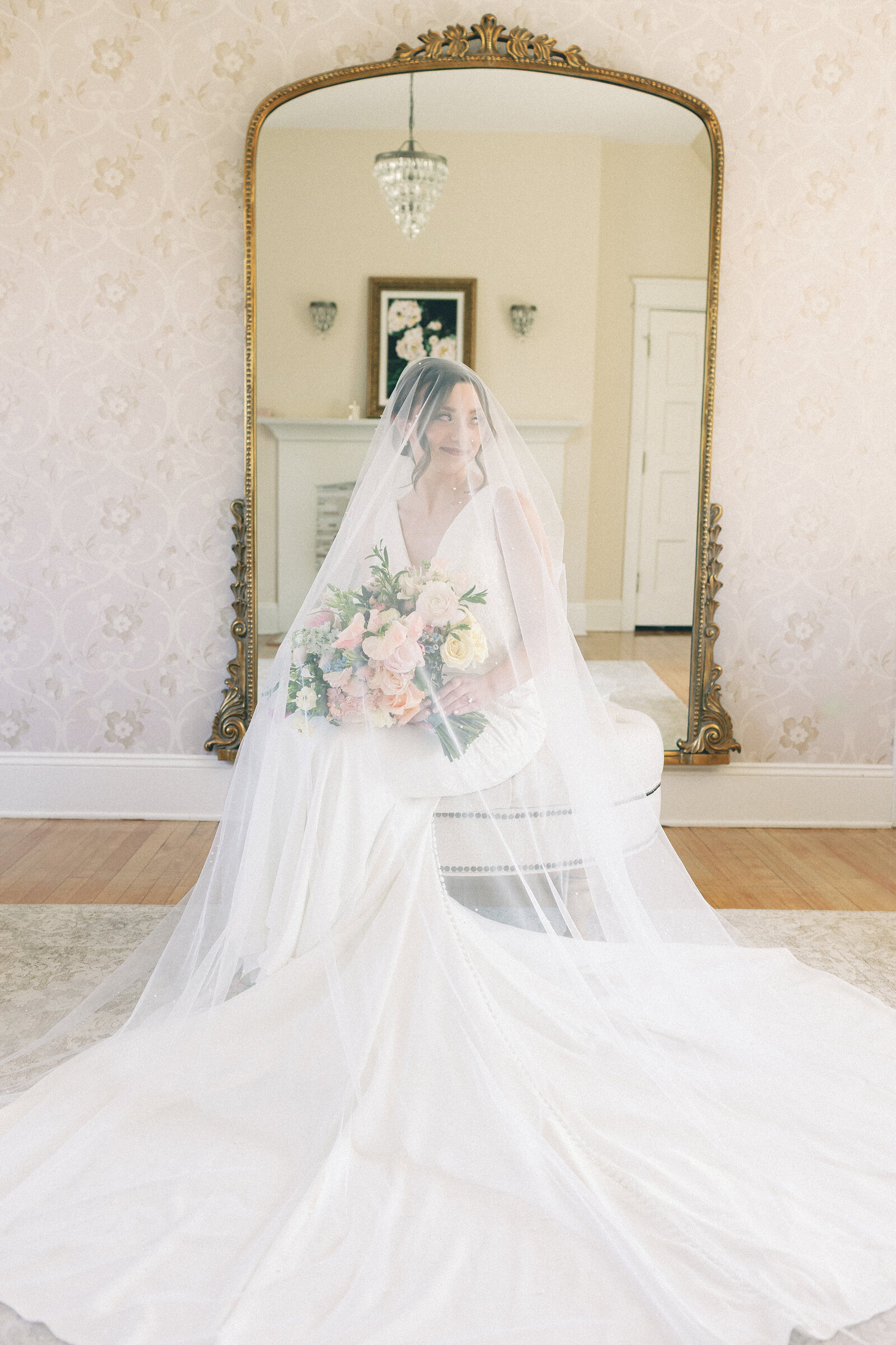 bride with veil in bridal suite