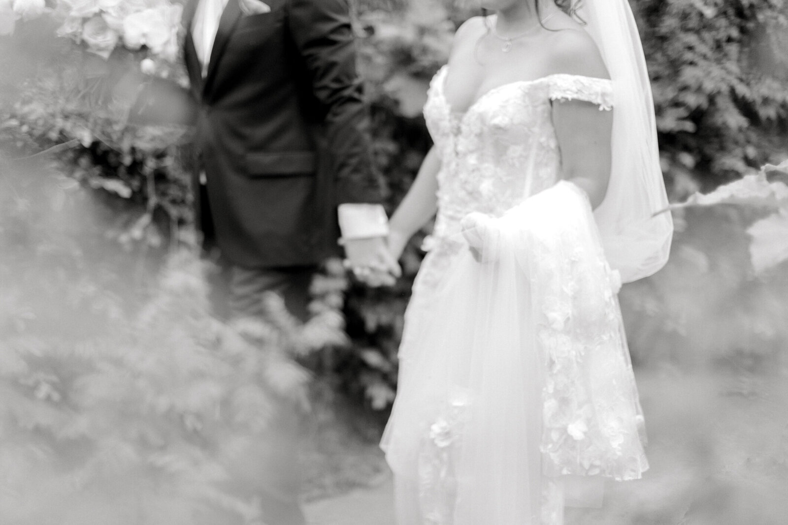 botanic garden wedding portrait of bride and groom holding hands