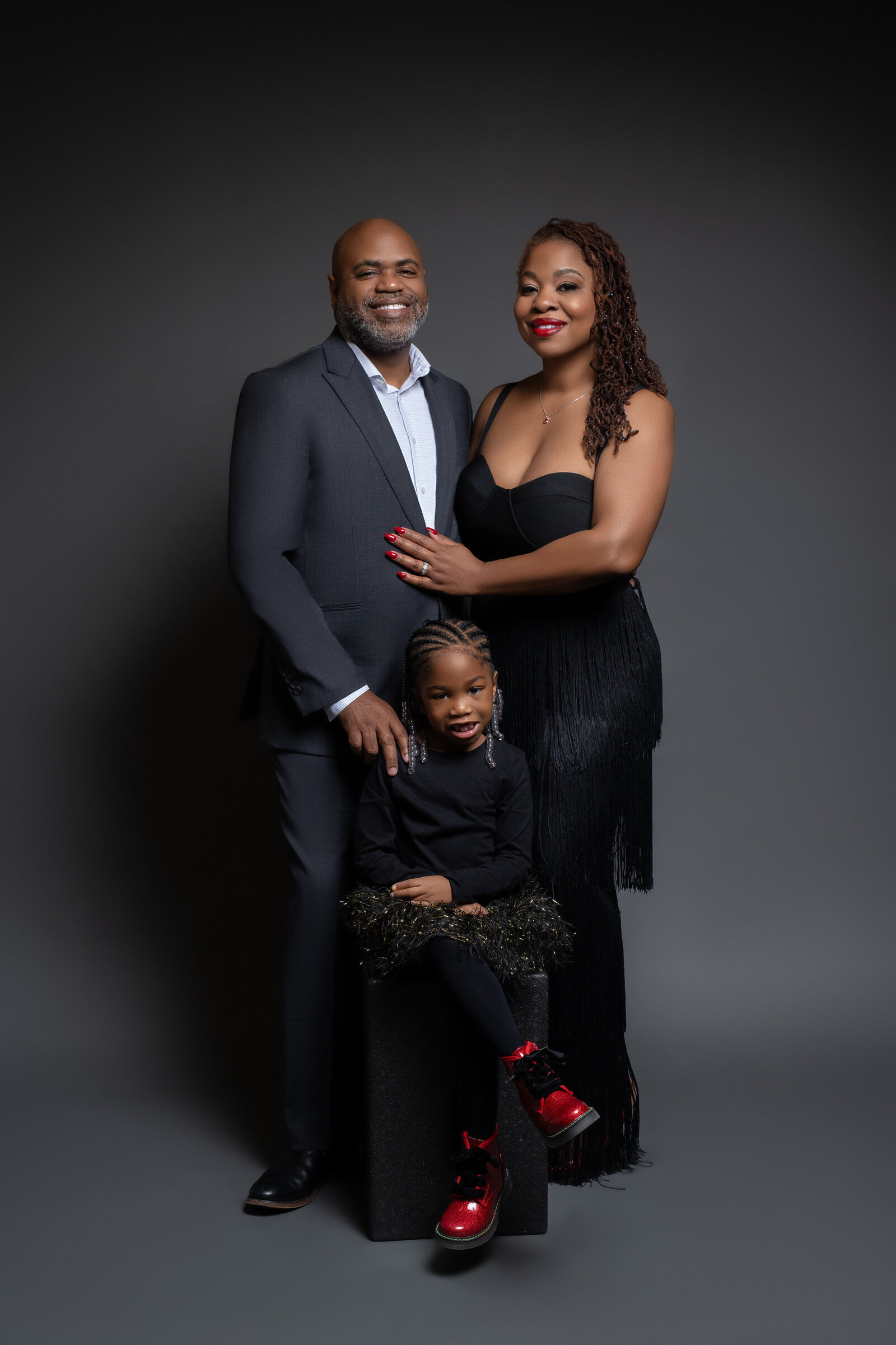 Washington DC husband and wife pose for family portrait with their 5 year old daughter 