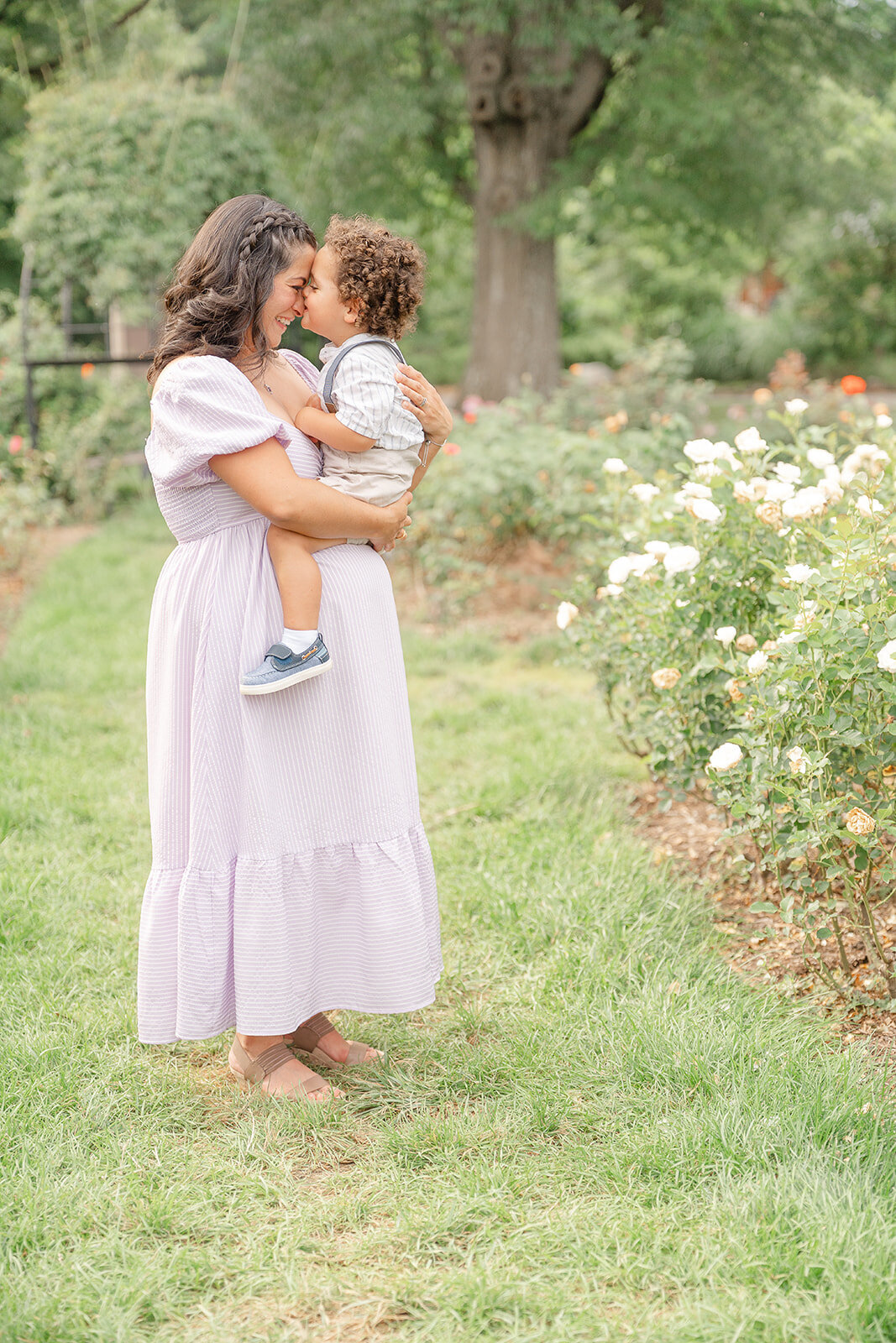 mom and son touching noses during Arlington, Virginia maternity photo
