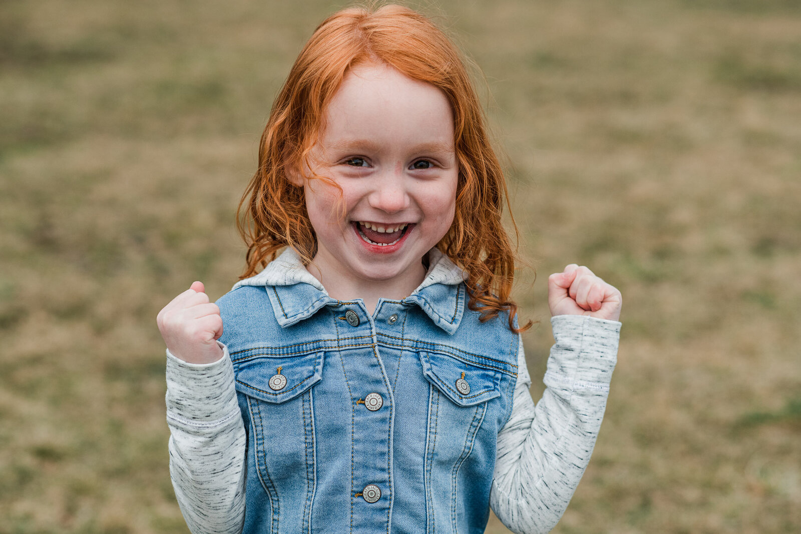 little girl in park smile big 