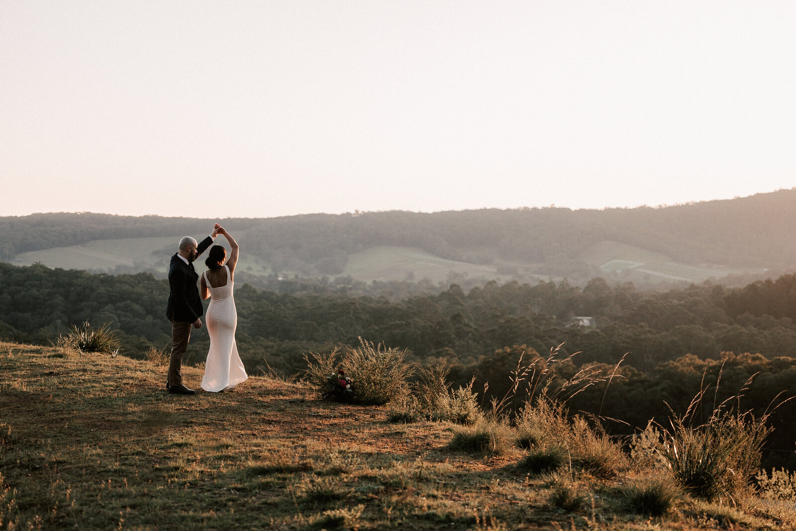 wedding couple dancing on mountain