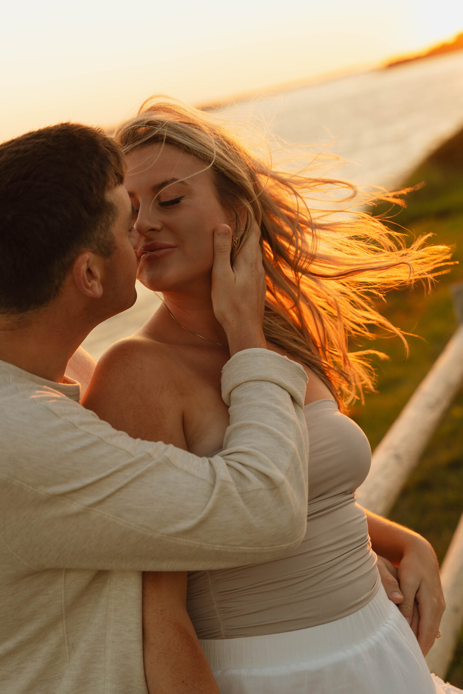a man holding a woman's face before they kiss