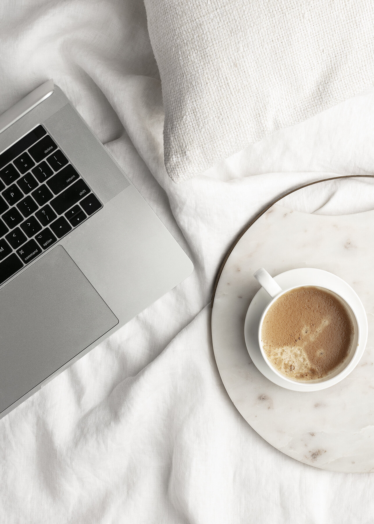 Coffee next to a laptop
