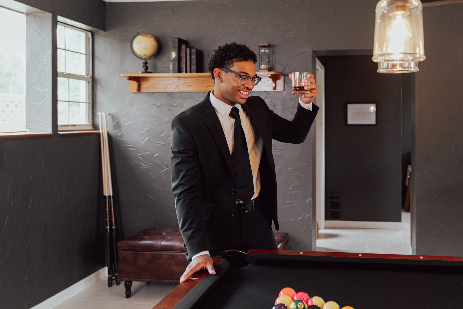 Groom holding his glass for cheers