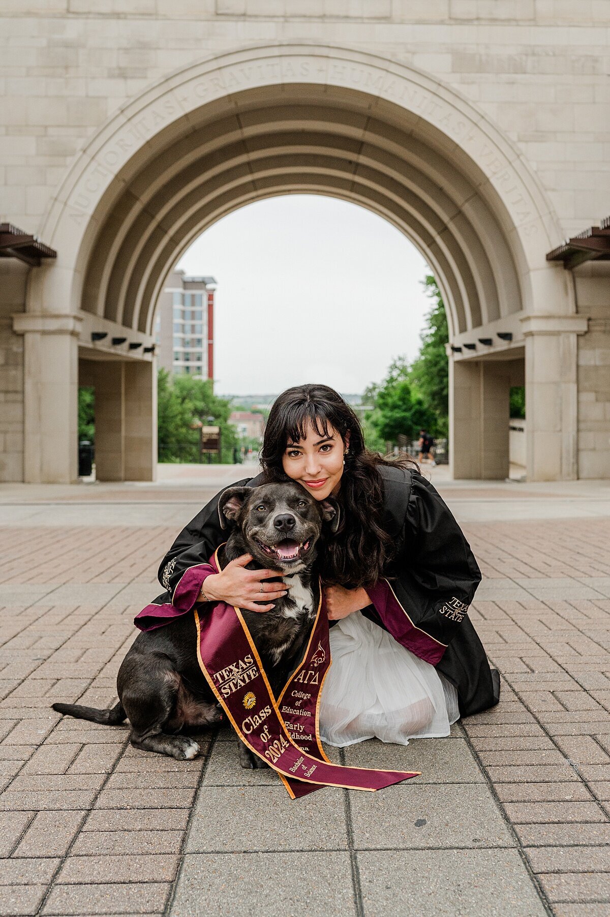 Texas State Graduate with dog