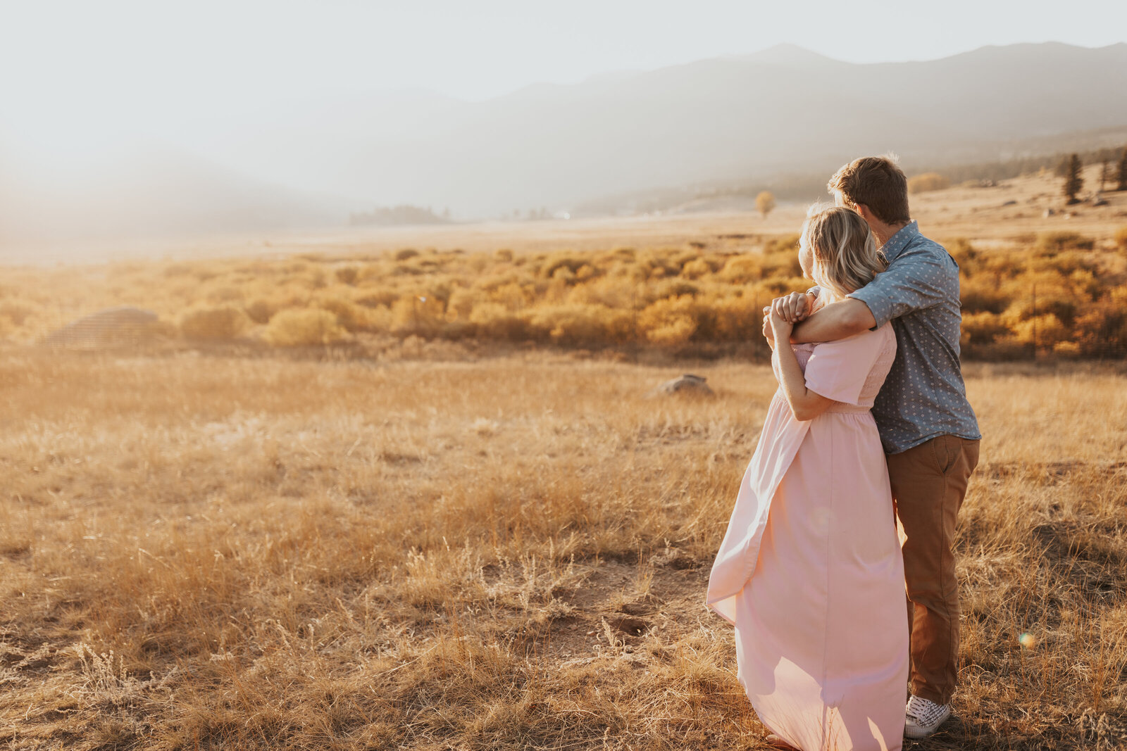 Couple watches the sunset in Rocky Mountain National Park