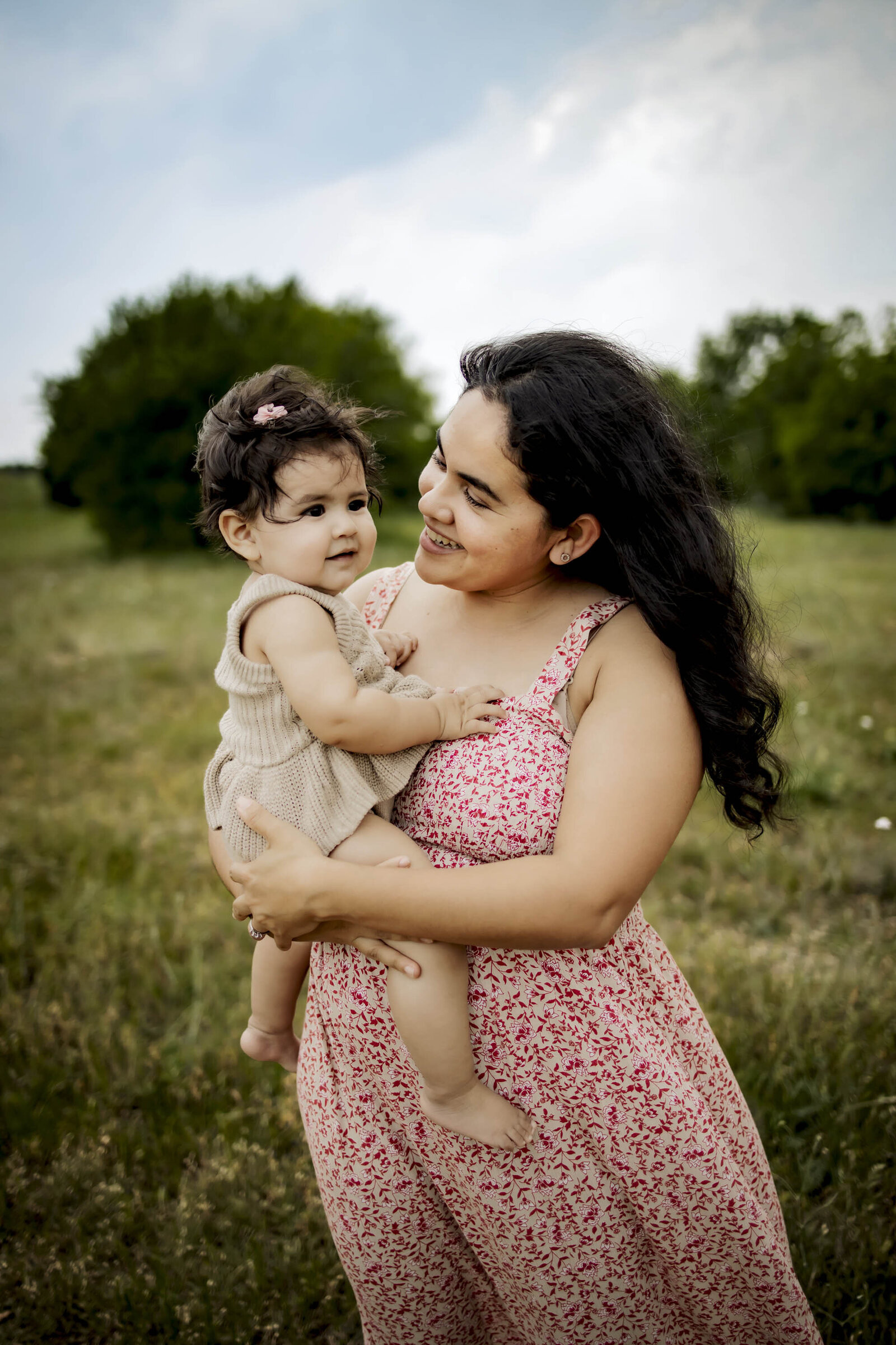 Latina mom with her infant baby girl