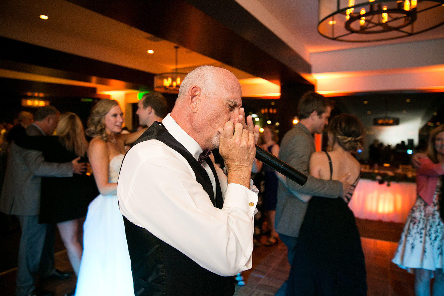 father of the bride singing at reception