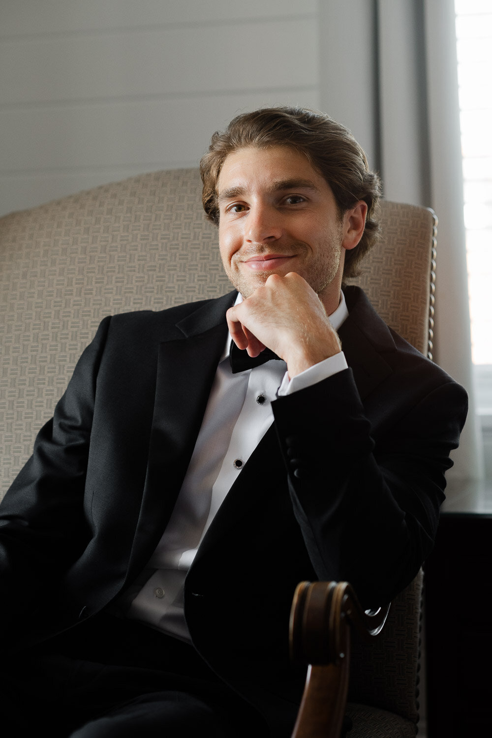 groom portrait in chair