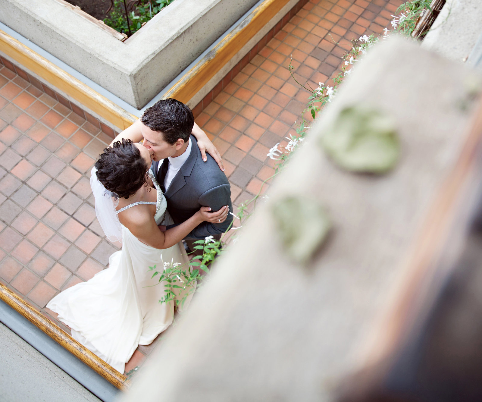 bride and groom kissing from above birds eye view