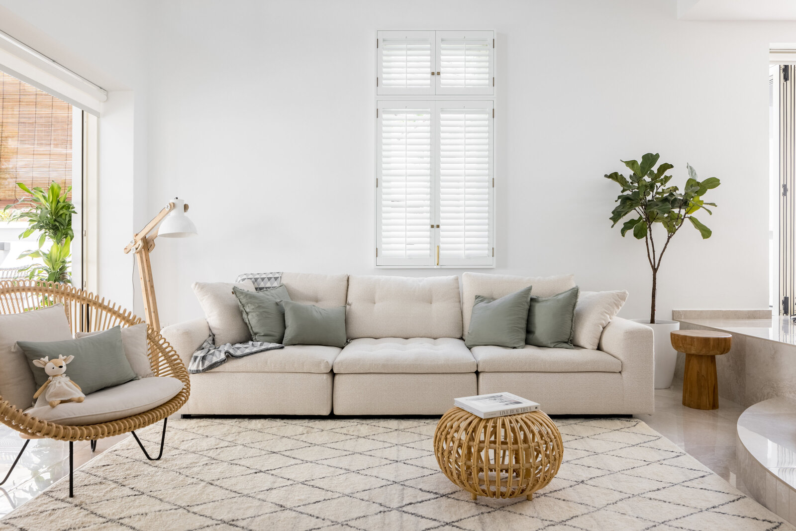 Large white sofa with pillows