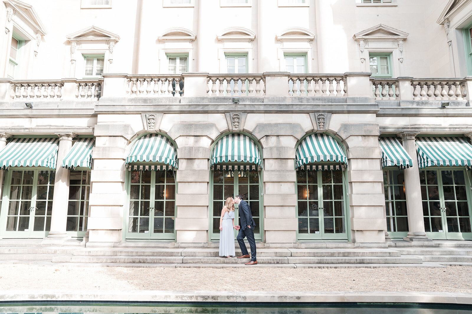 Larz Anderson House engagement photo in Washington DC with couple walking outdoors.1