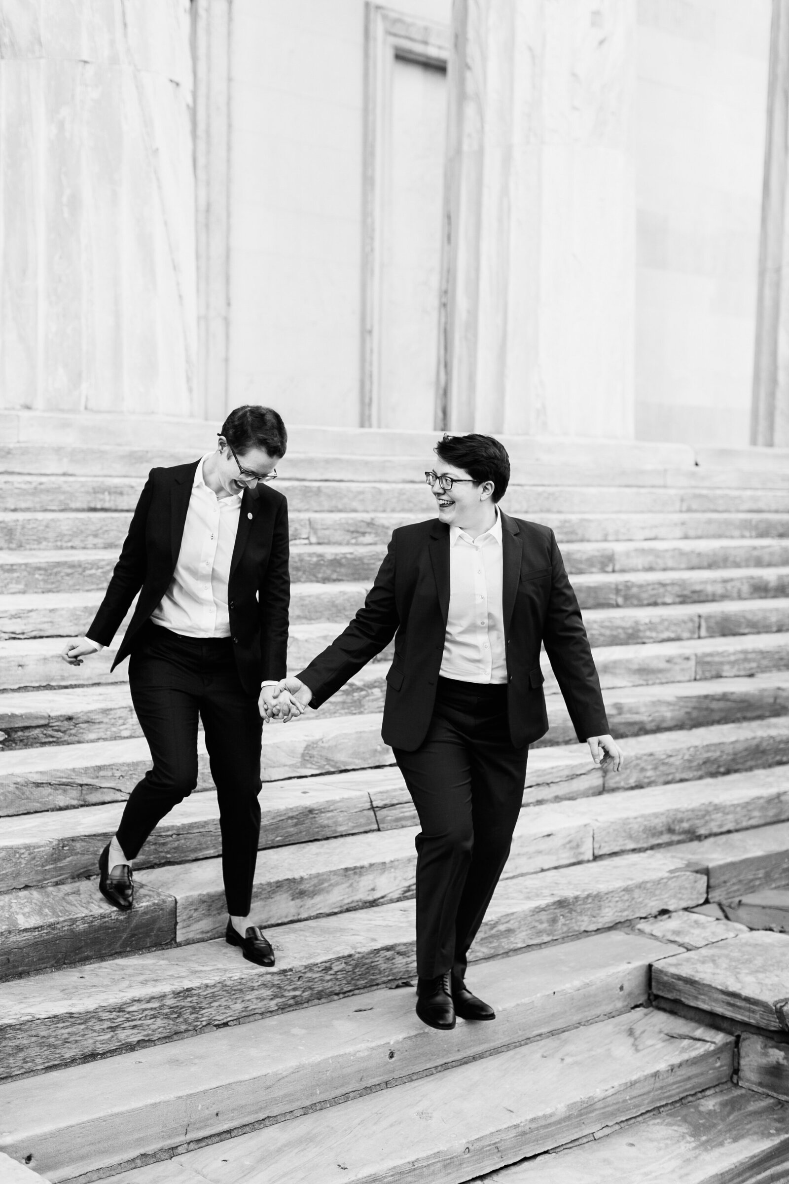 gay brides suits on city steps