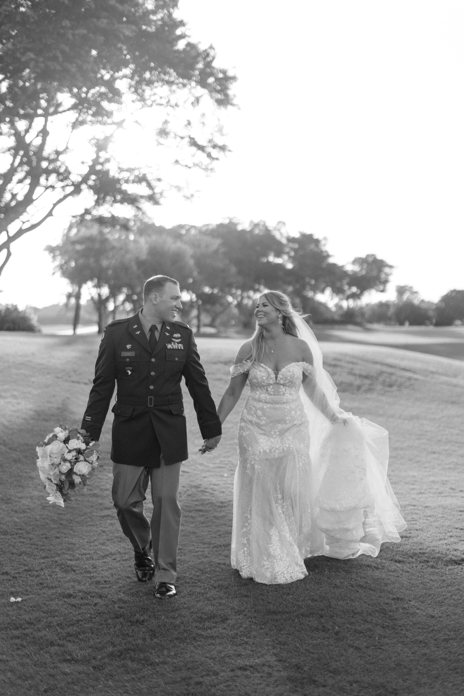 Bride and Groom walk along the golf course at this country club wedding in Palm Beach, Florida. Photo by Maggie Alvarez Photography