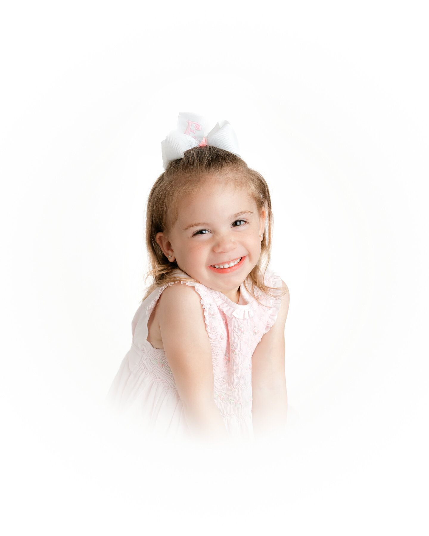 Little girl smiling for her classic heirloom portraits with photographer Constance Calton in Savannah, Ga