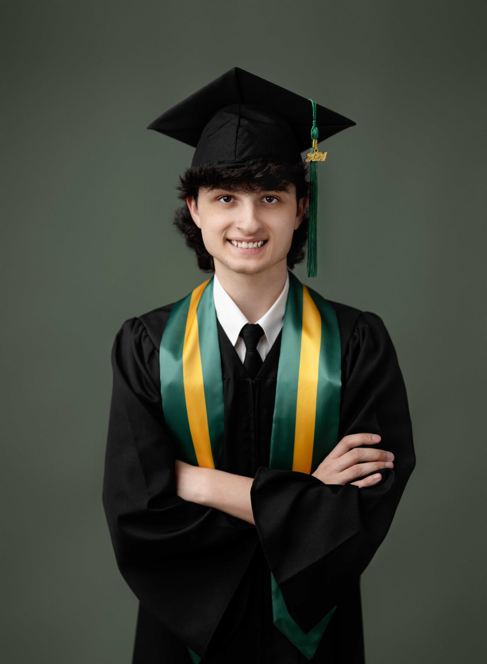 Cap and gown headshot of boy. Senior graduation photos taken by Jenni Nikki Photography in Woodstock, GA