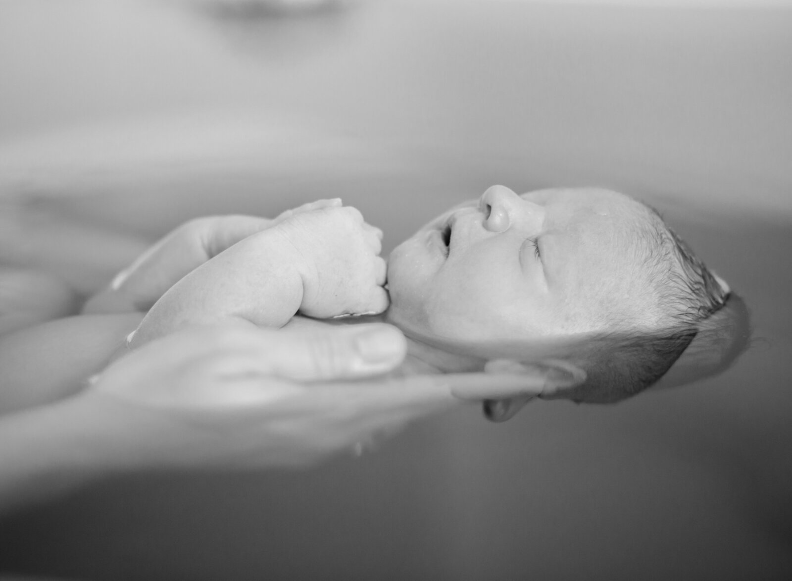 baby in herbal bath