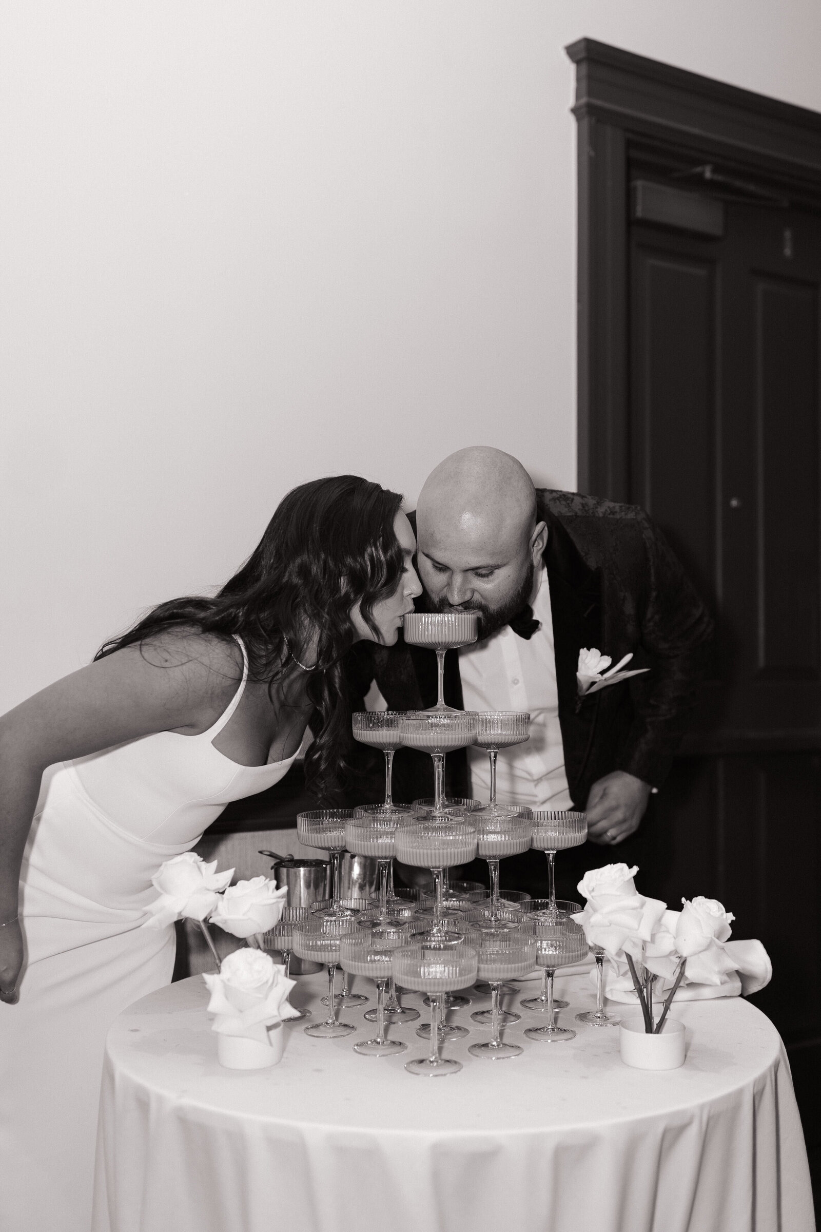 Couple drinking from champagne fountain at Sun Valley, Idaho wedding