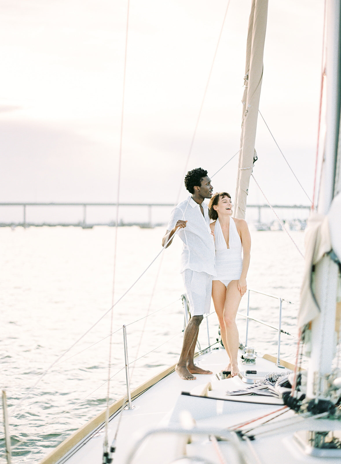 Charleston SC engagement session on sailboat photographed by wedding photographers in Charleston Amy Mulder Photography