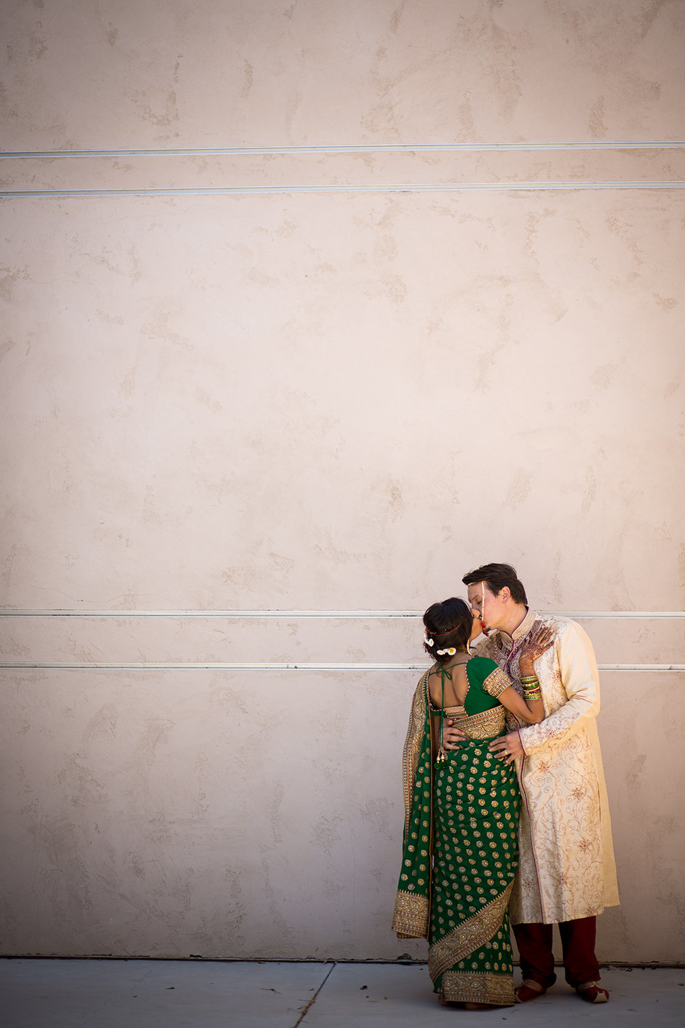 Lovely Indian couple sneaking a kiss