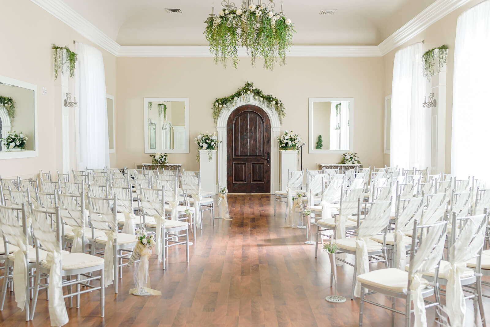 Light shines through the windows of the intimate wedding chapel at Stone Gate Weddings in Pleasant Grove.
