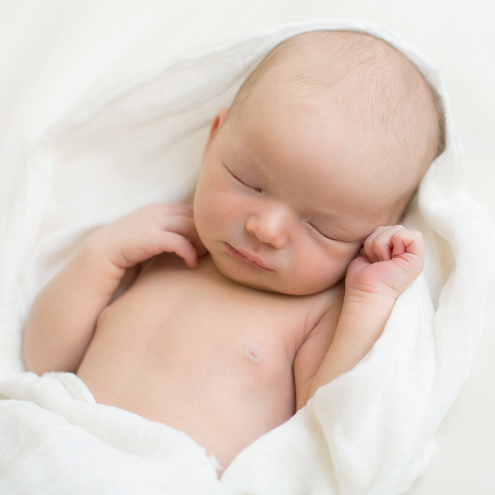 sleeping_newborn_on_white