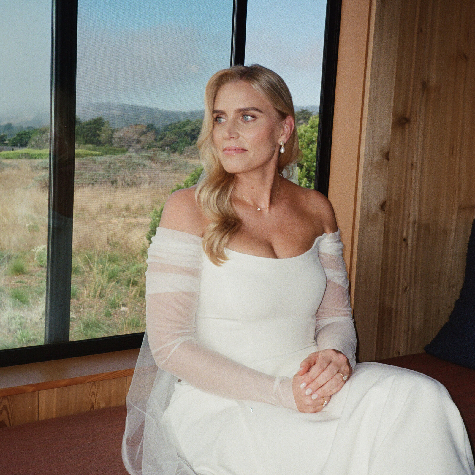 Bride wearing romantic rosy tones at Sea Ranch ceremony
