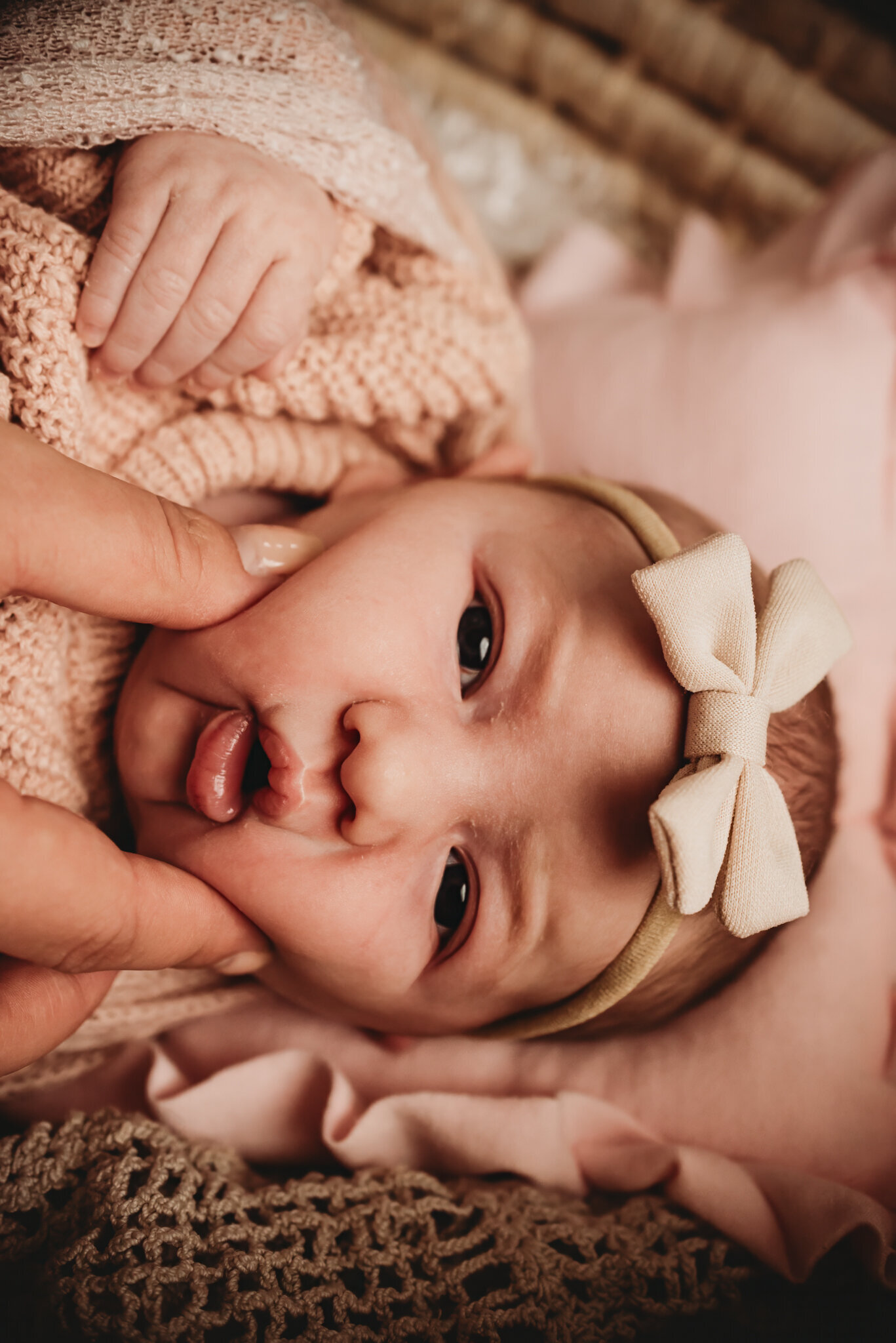 Theres nothing better than chubby cheeks on a little newborn. Capturing those tiny details are part of a newborn photoshoot with Nikii Pix Photography.