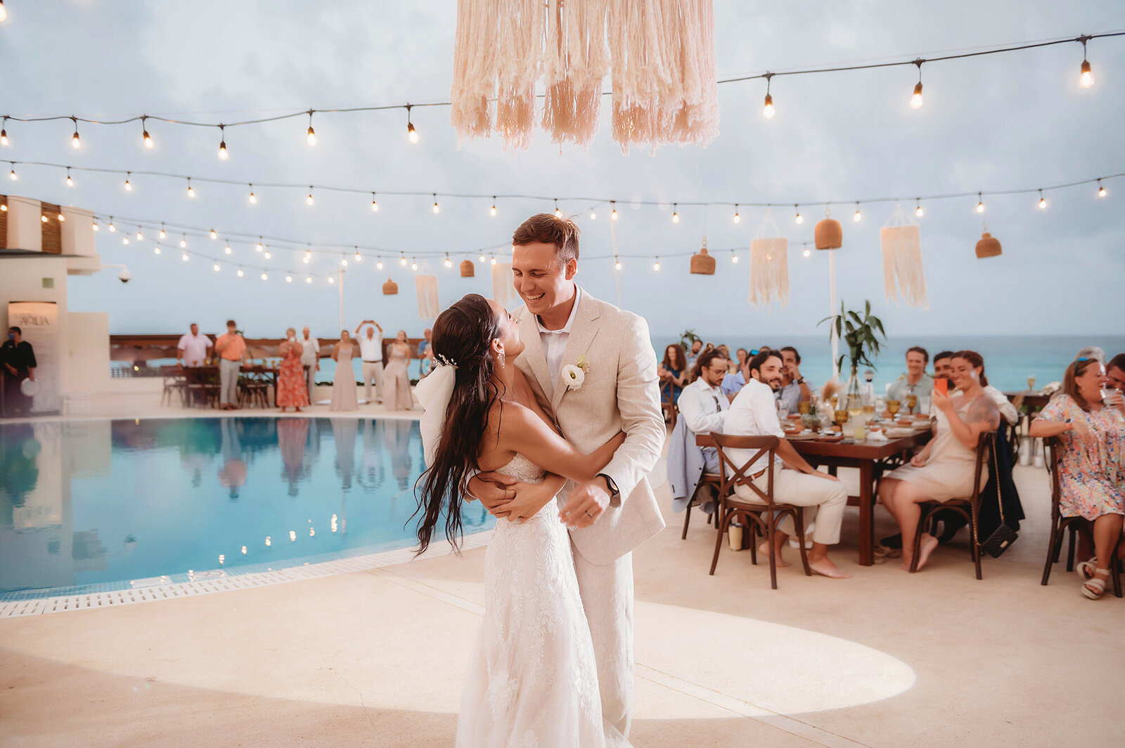 Newlyweds dance during their Micro-Wedding Reception at Live Aqua Resort in Cancun, Mexico.