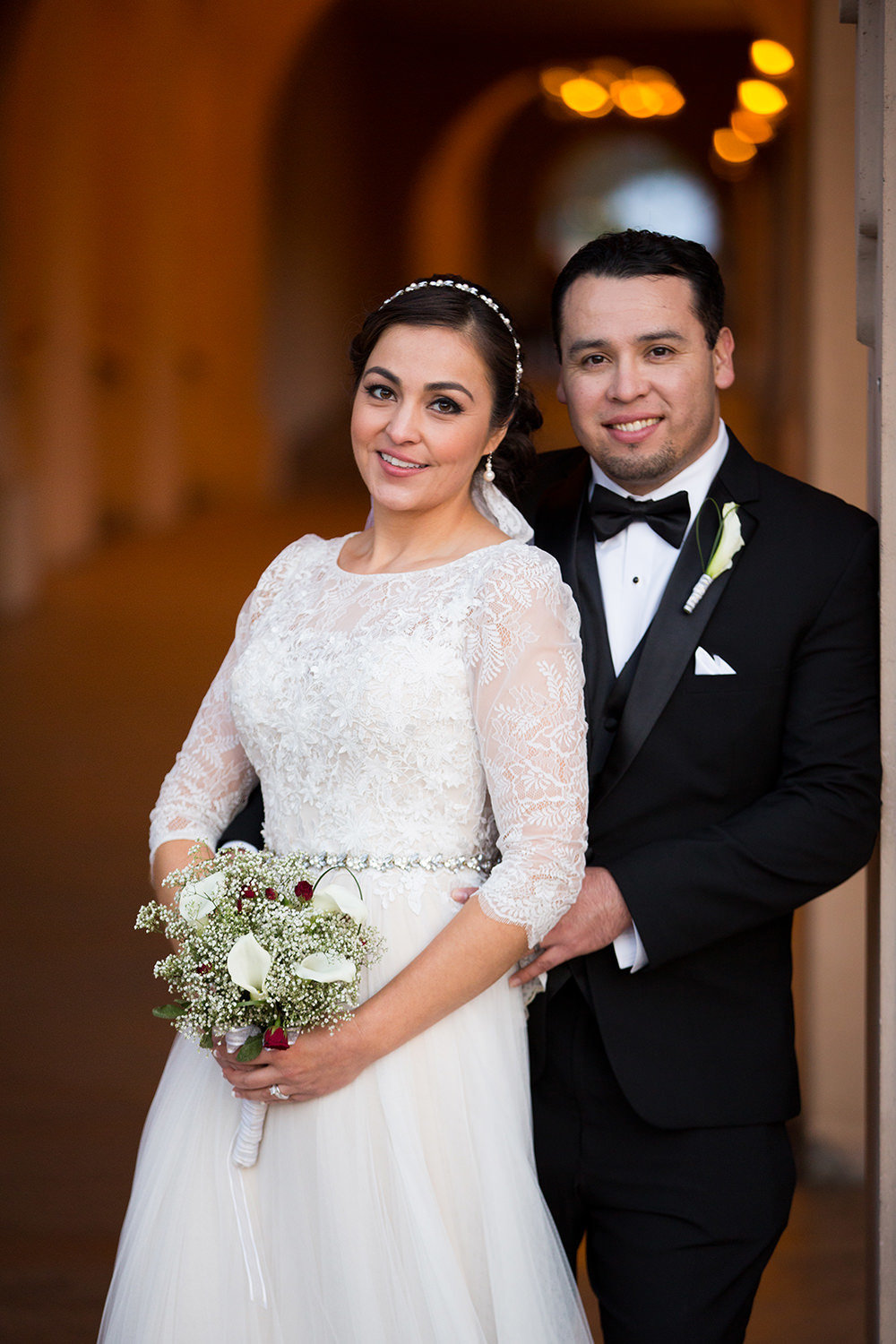 bride in groom in balboa park for their prado wedding