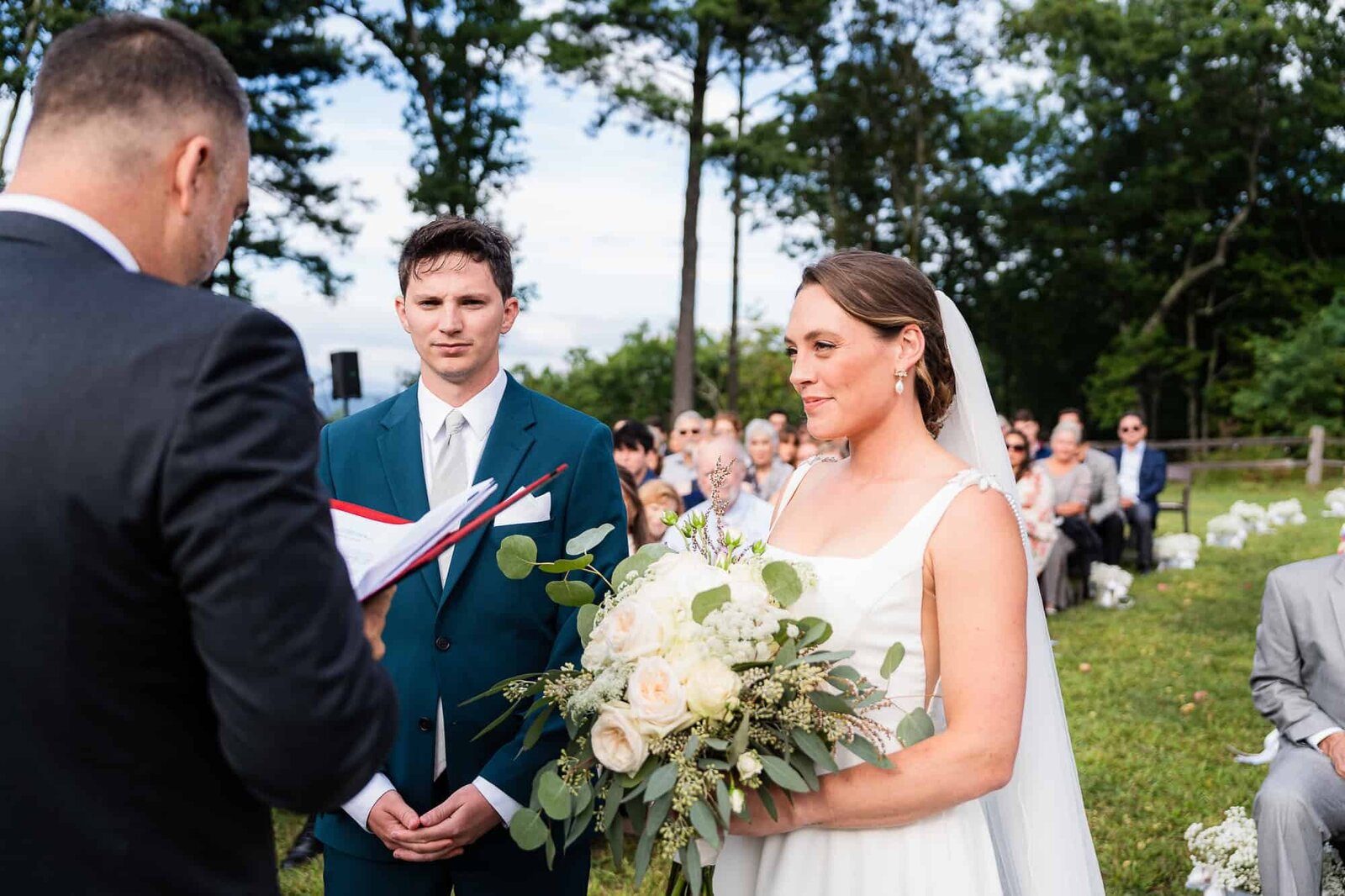 bride and groom during their wedding ceremony at terra incognita vineyard wedding venue 