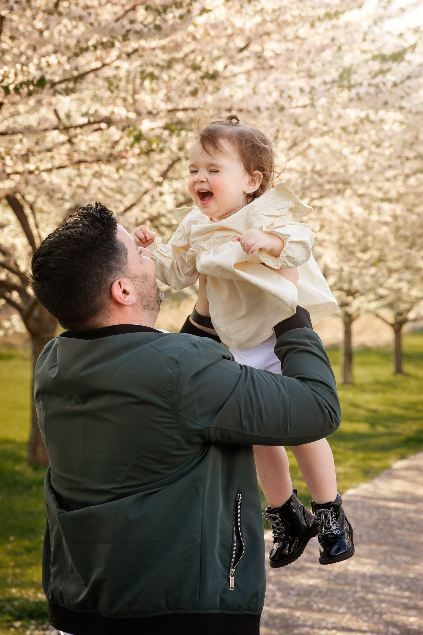 dad-and-baby-laughing-central-park-morristown-family-photographers-new-jersey