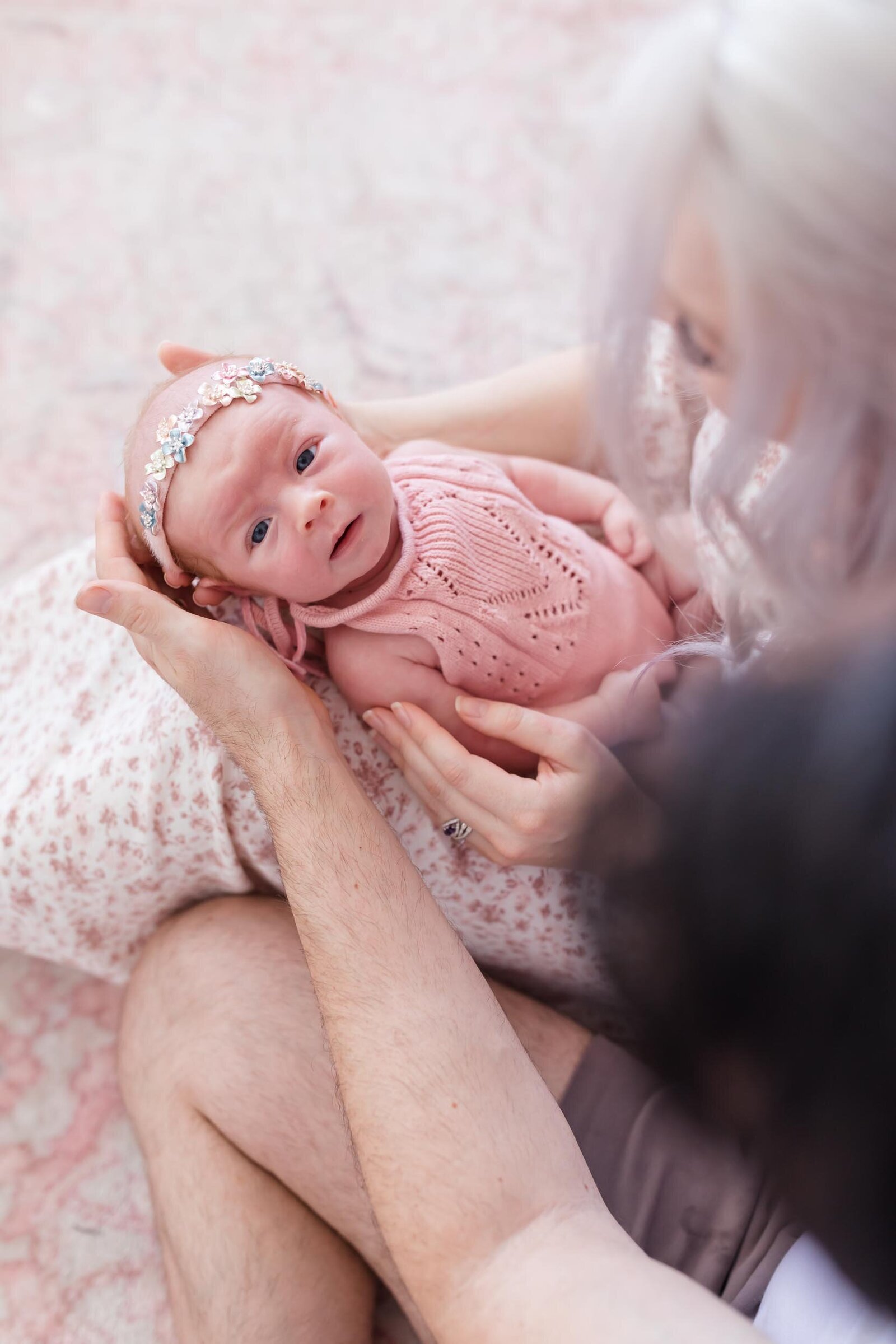 orlando newborn photographer parents holding baby