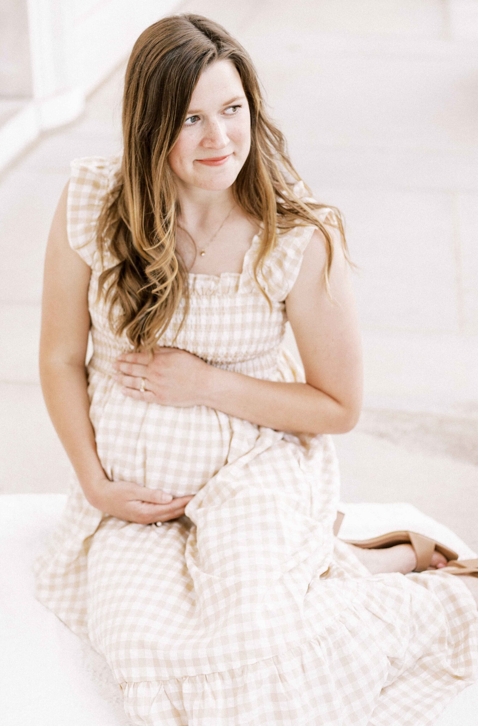 mom holding baby bump in peoria illinois maternity photos 