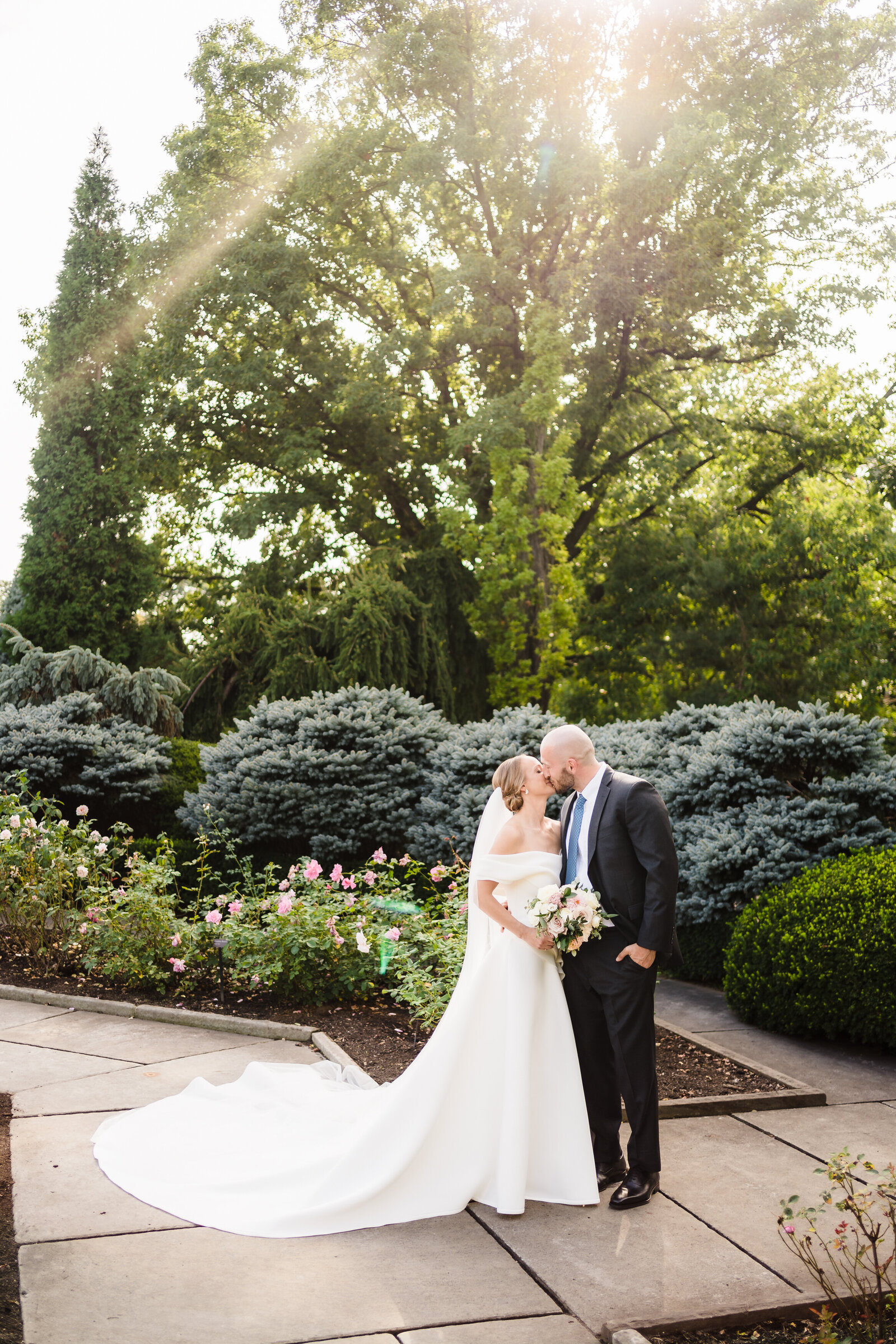 Bride and groom share a kiss at the Cleveland Botanical Gardens