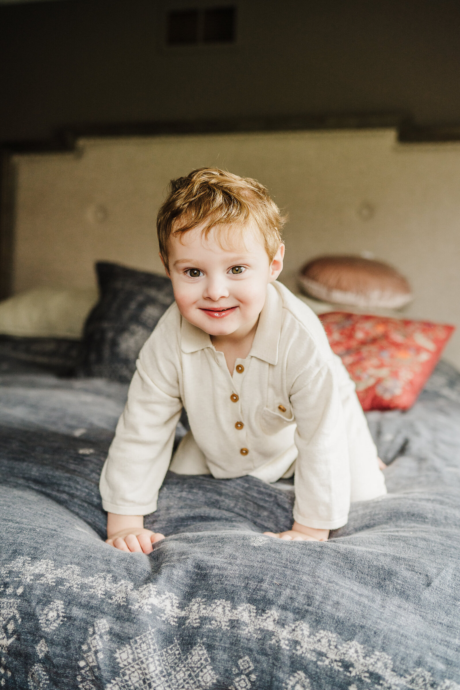 toddler boy on bed