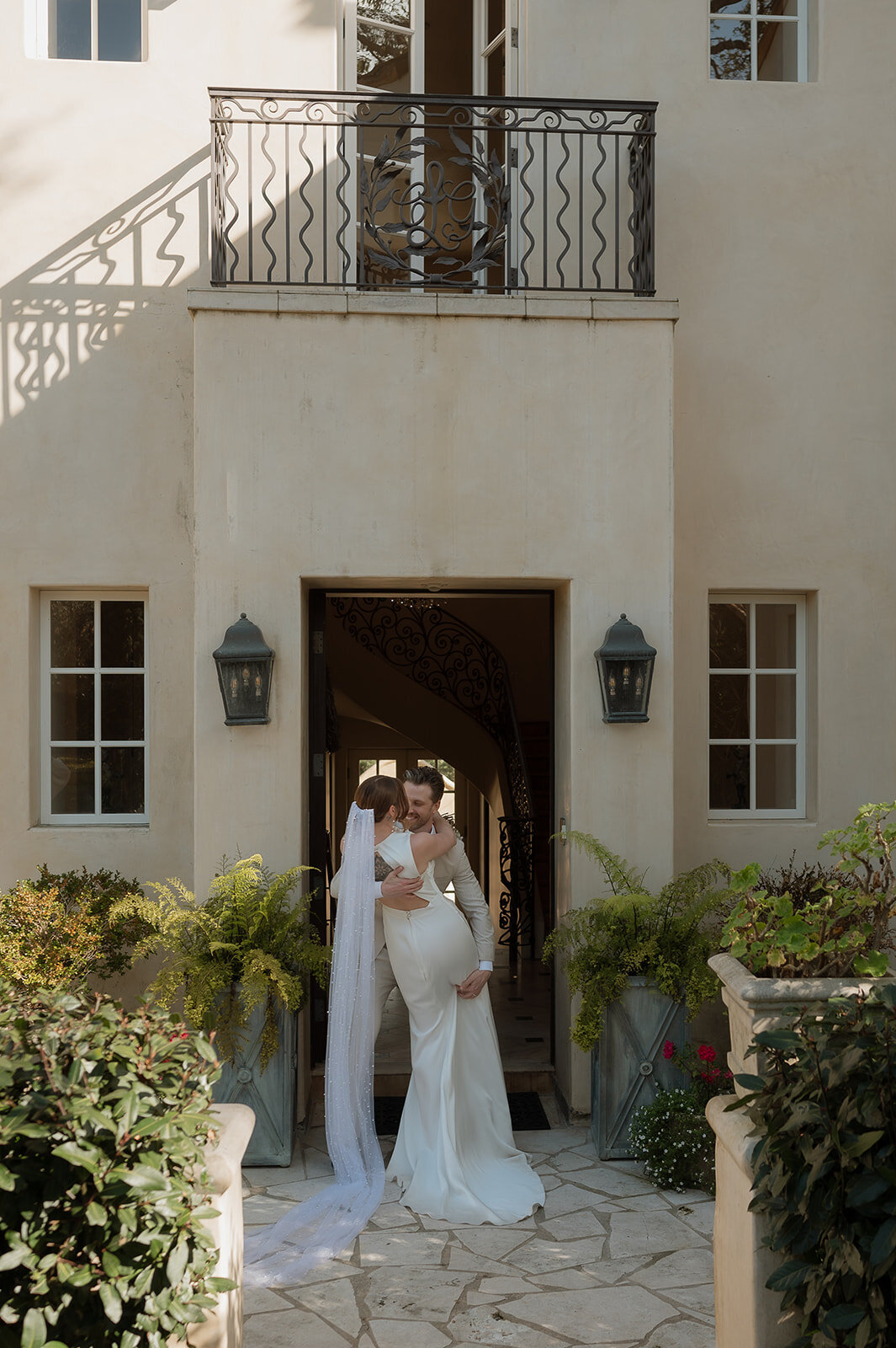couple holding each other during italian themed elopement
