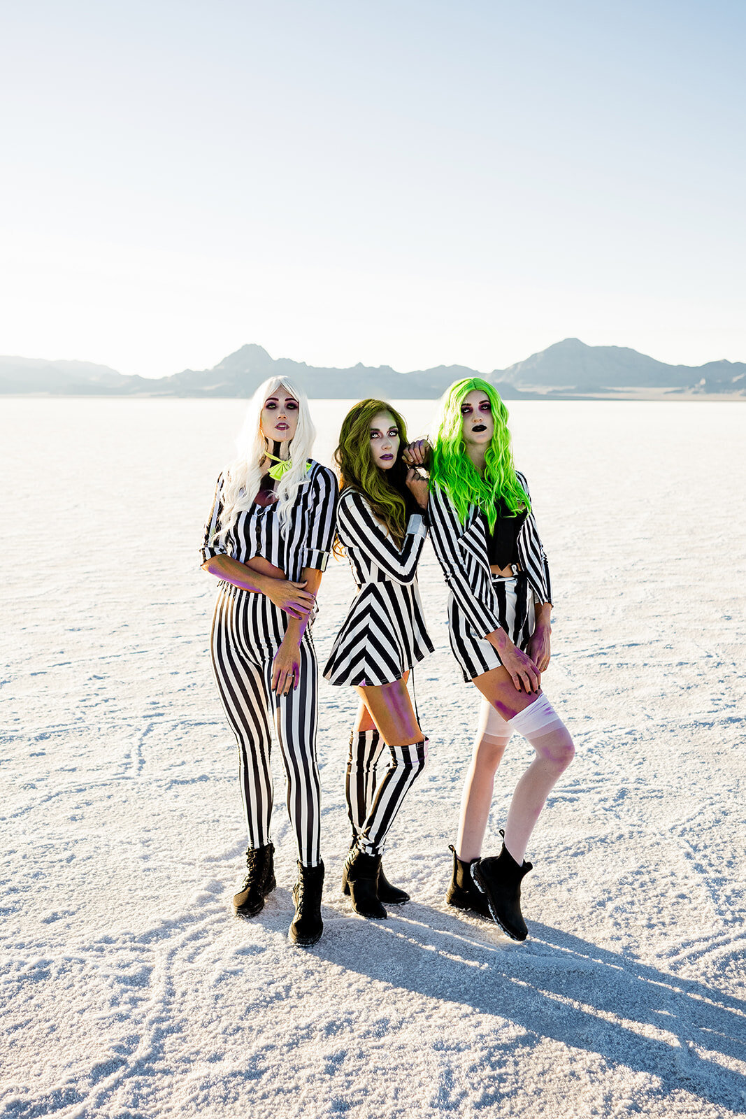 three women dressed up as beetle juice at the salt flats