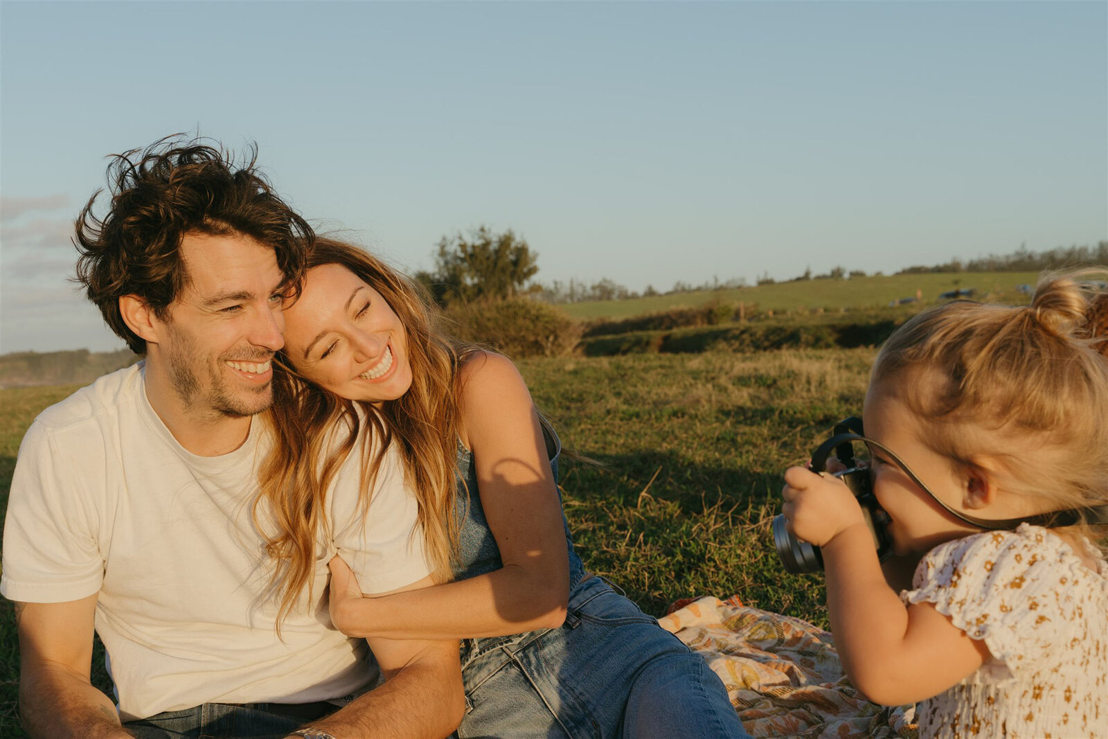Together on Maui during a family photography session, natural laughter and candid joy.