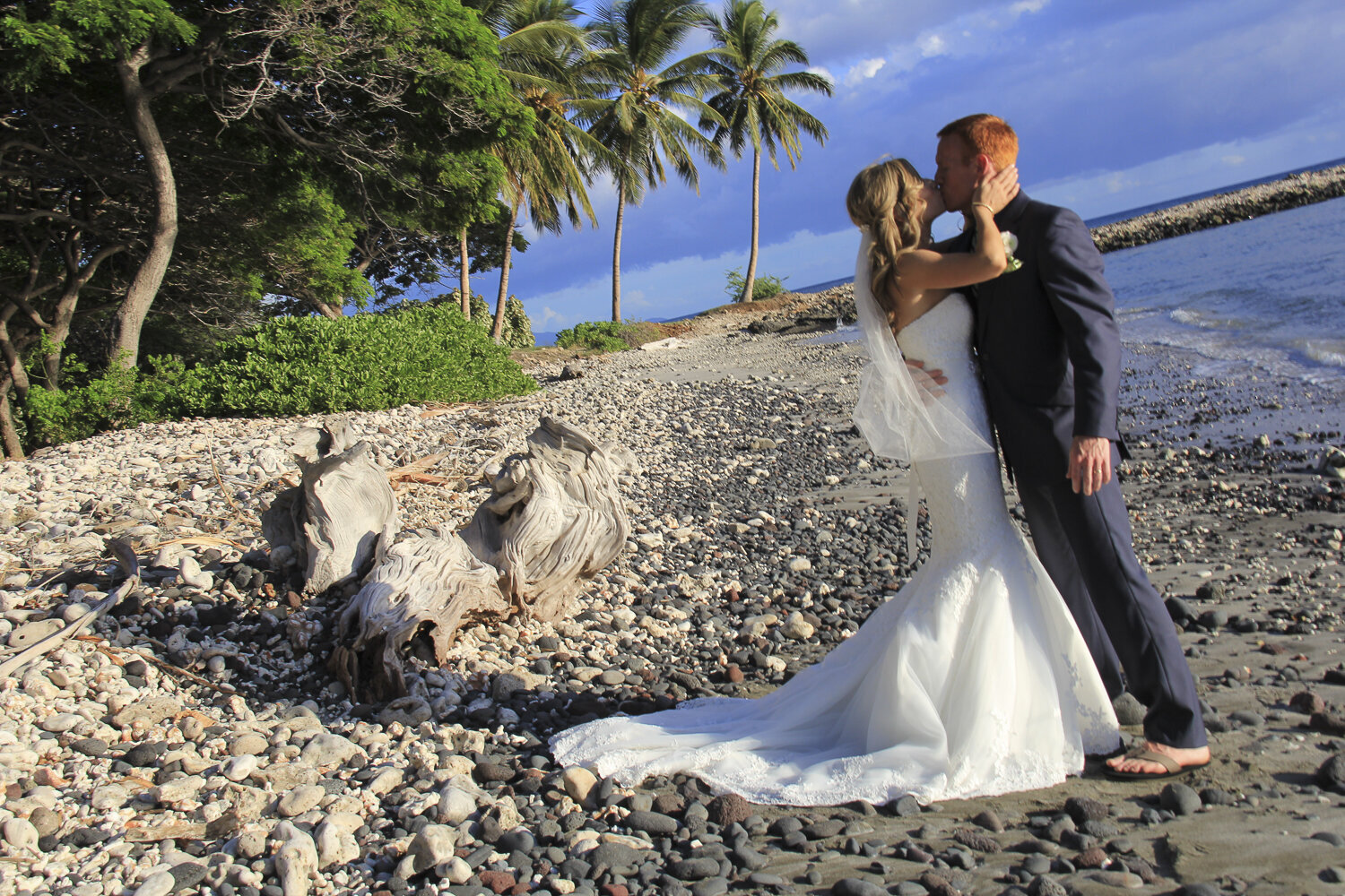 Caroline Morey Wedding Photographer Maui Destination Wedding Olowalu Plantation Wedding Romantic Couple Kissing Palm Trees Beach Shoreline Blues Greens 110413_684