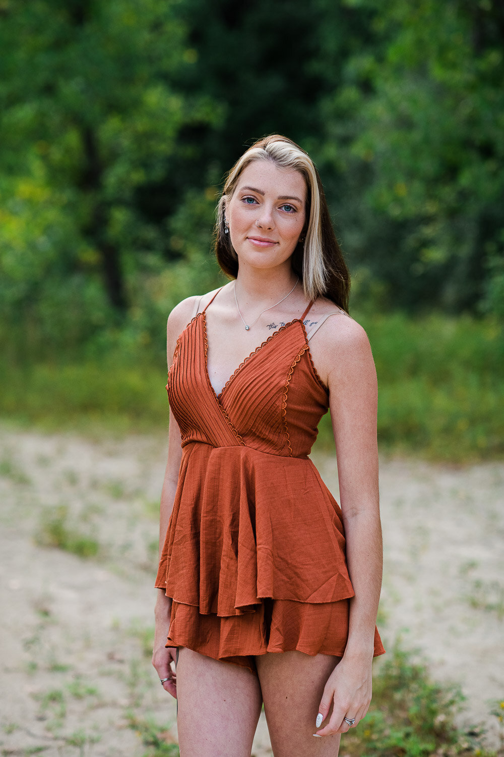 grad girl standing in woods