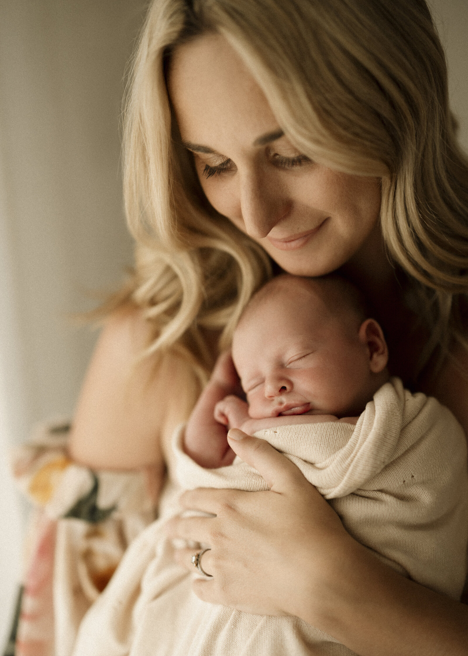 Natural newborn family portraits in a Perth studio – soft, warm, and organic images capturing the love of a growing family.