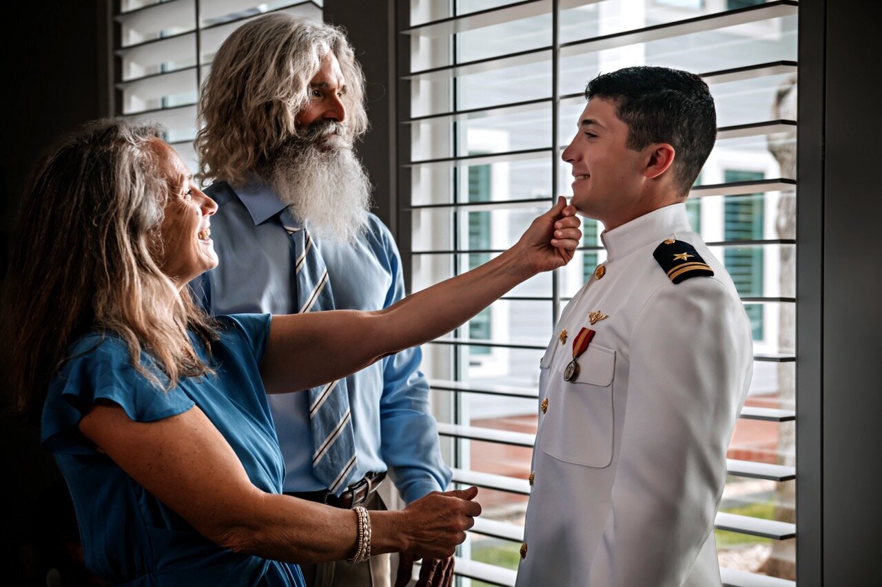 A heartfelt moment as the groom's parents offer advice and support before the wedding ceremony, captured by CMH Studios during a luxury San Antonio wedding