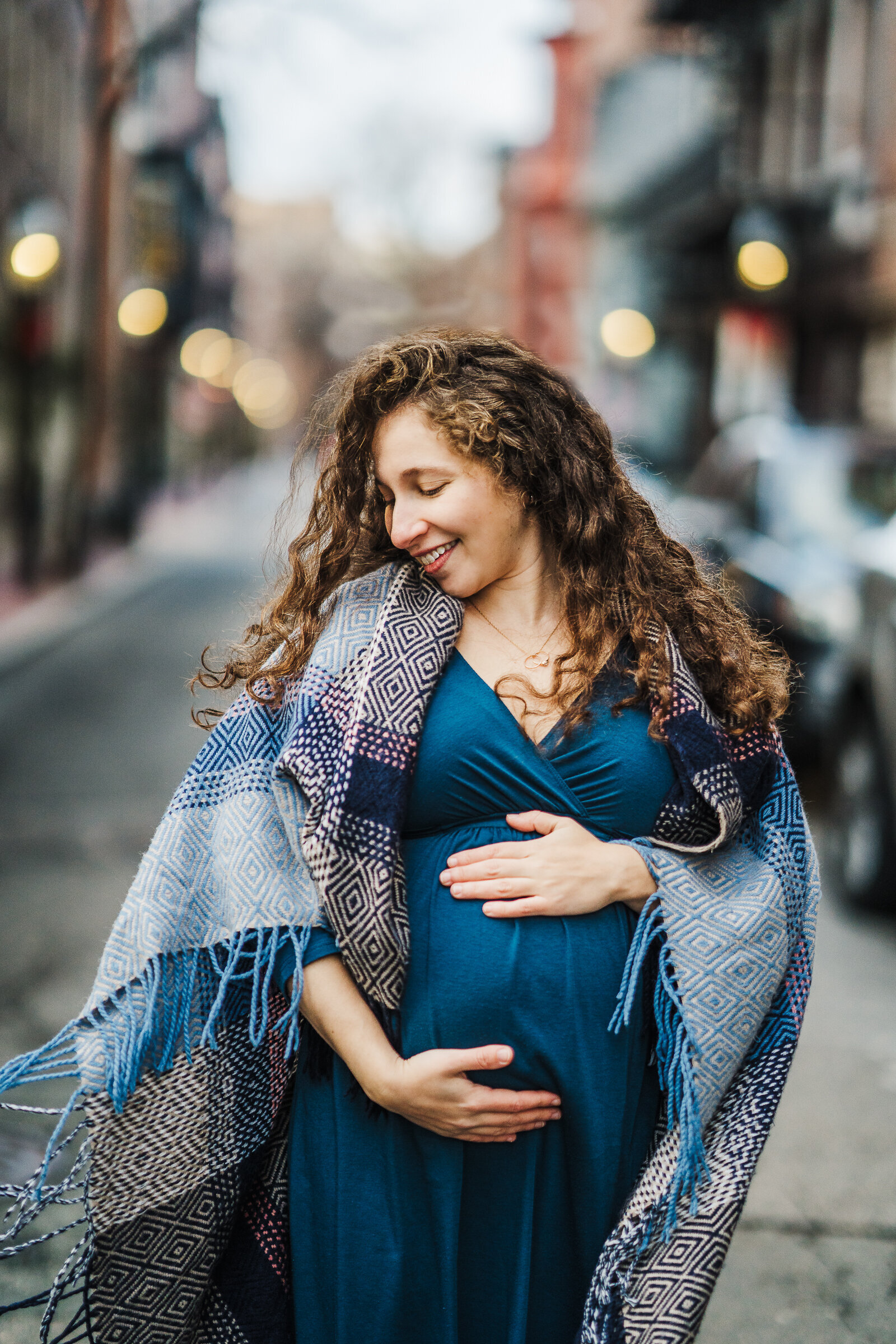 pregnant mom in blue dress in city