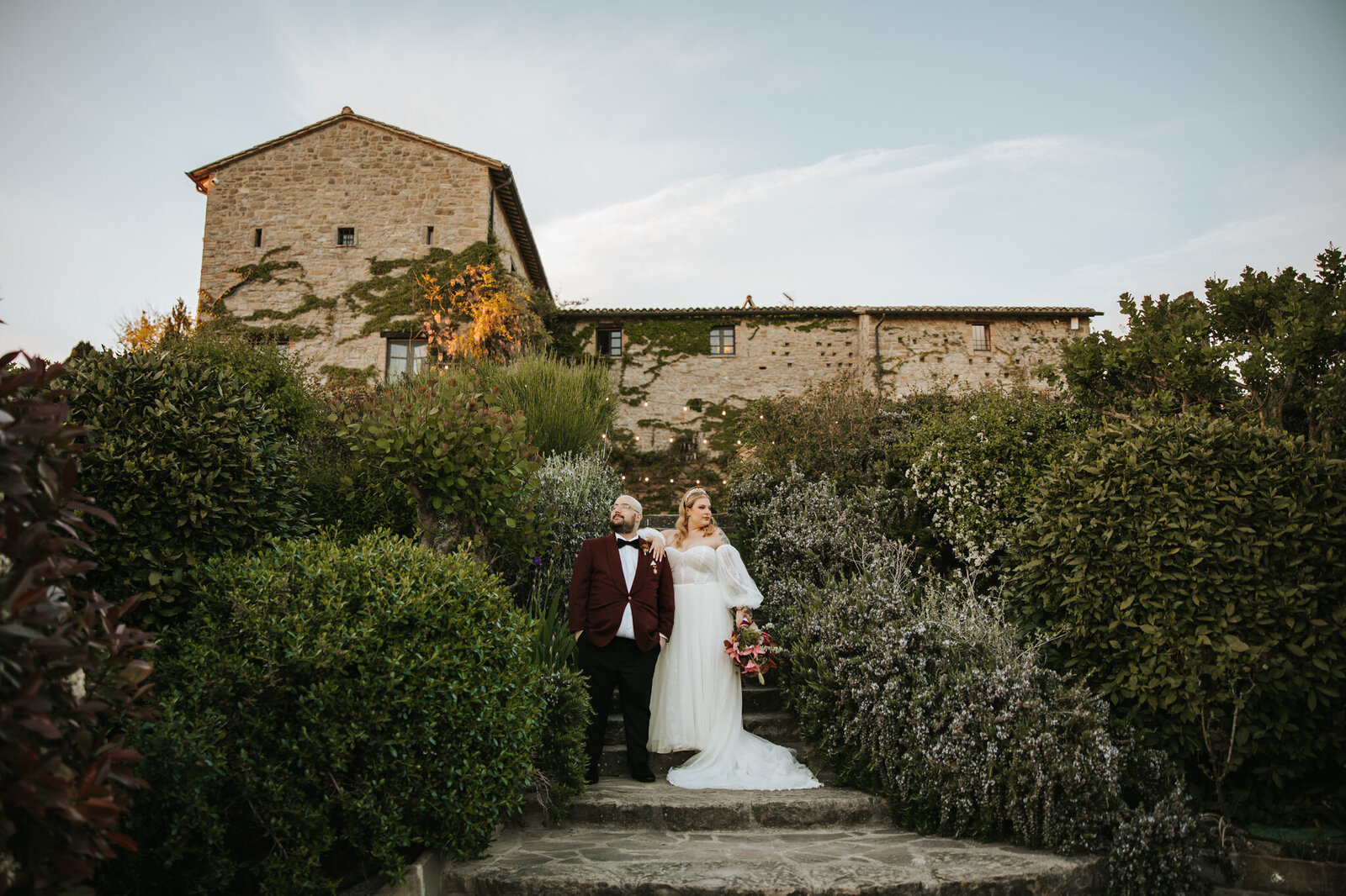 Couple sharing a magical moment on their wedding day in Tuscany’s rolling hills.