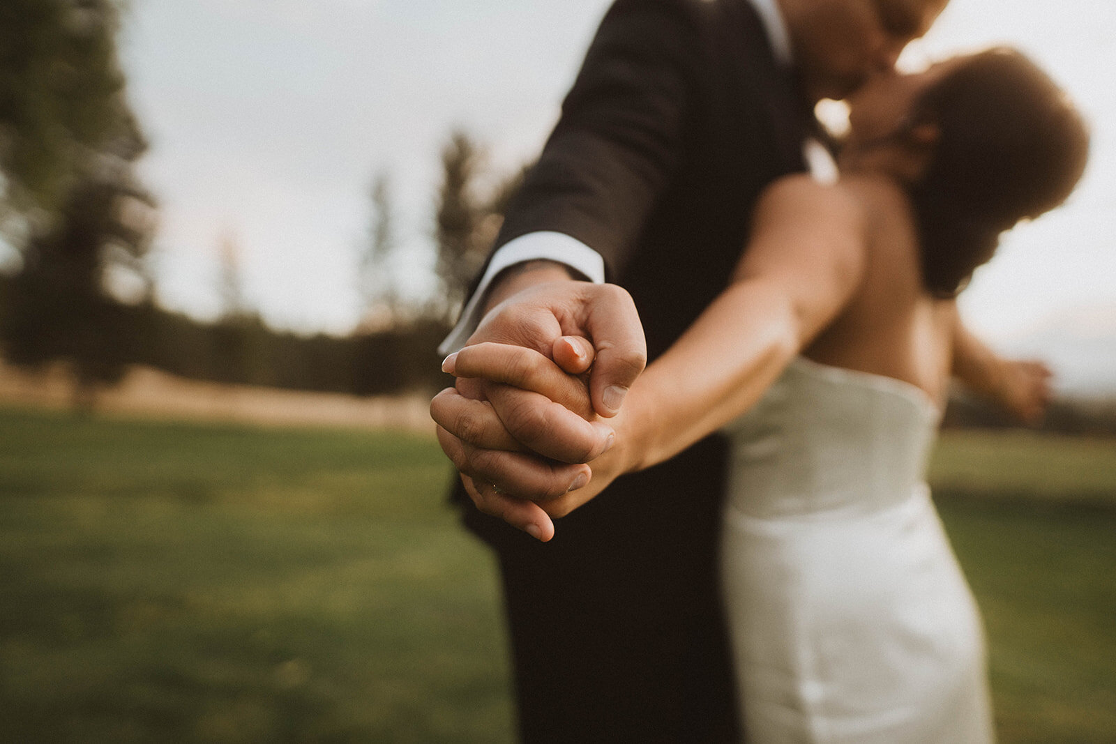 intimate wedding photographer gallery header photo of bride and groom's hands during their Beacon Hill wedding in Spokane