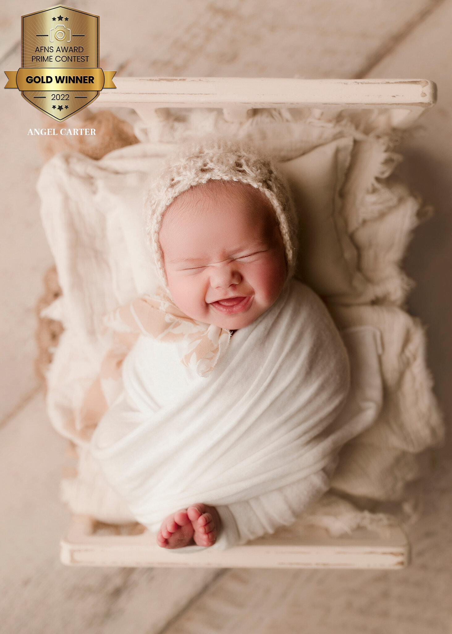 the biggest smile from baby girl at her photo session. 9/10 times we capture your newborn smiling at least once during their session with us. This is a true memory to savor.