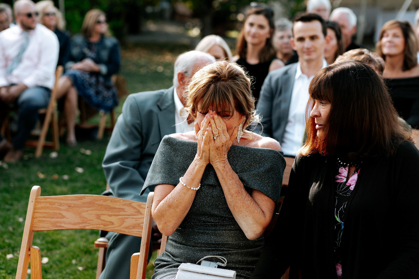 great photo of mother of the groom crying at wedding.